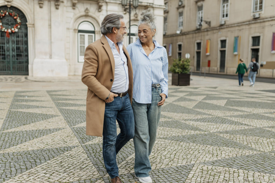 Older couple walking together outdoors